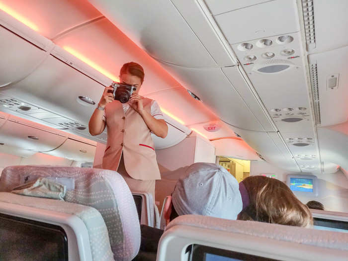 With only 45 minutes left, the flight attendants went around to (I think) couples that had reported they were on their honeymoon. They took a Polaroid of the couple and gave them a special treat.