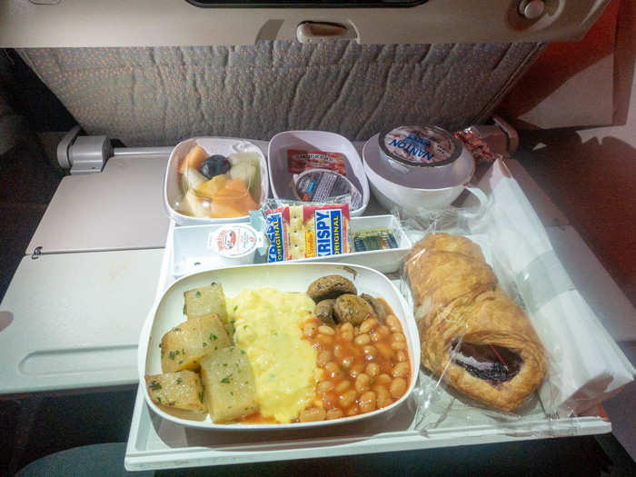 With passengers all but awake, the flight attendants started our final meal service. I opted for the eggs with potatoes, beans, and mushrooms. It