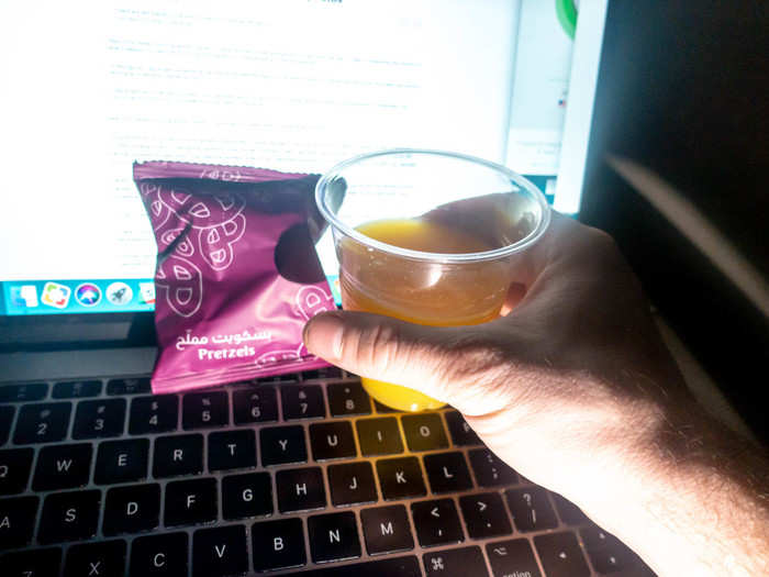 About seven hours into the flight, flight attendants came by to offer orange juice, water, and pretzels. Not exactly a full beverage service, but it was appreciated.