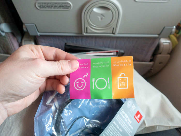 The kit comes with a handy sticker set so you can let the flight attendants know whether to wake you up for meals. I