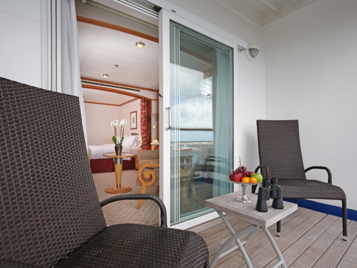 Glass doors open onto a private veranda.