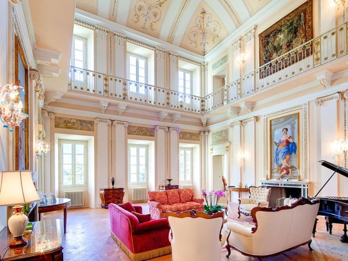 A grand 18th-century villa with lavish interiors, a garden, indoor and outdoor playground, a home cinema, and access to Lake Como. It also has a pizza oven and daily maid service.