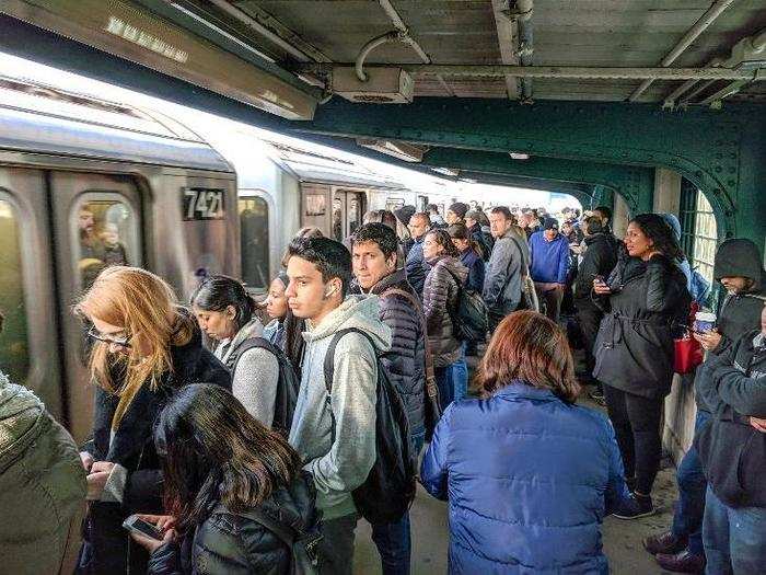 Rush hour platforms are not much fun. By Junction Boulevard, there’s not even room to walk — and once the doors open, things can get dicey as people shuffle to make it on the train