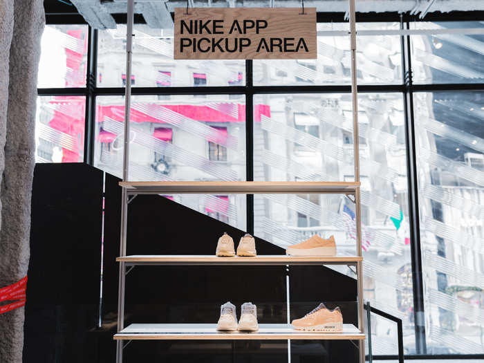 Dedicated pickup areas for app users are also littered throughout, as the app lets customers digitally request to try on a shoe. An employee comes to this spot to find the user after fetching the item from store shelves.