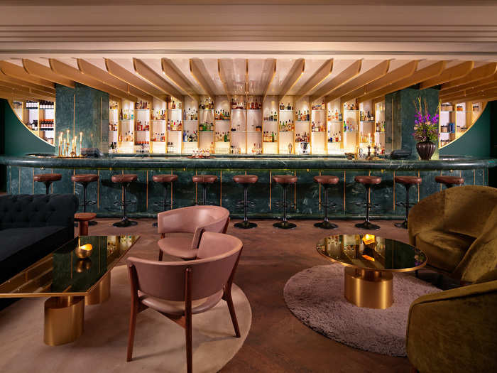 The stylish interiors are Art-Deco in vibe, with homage to the Sea Containers building the bar and hotel sits in — the space, from British designer Tom Dixon, is partly inspired with references to "the luxurious cruise liners of generations past," and is filled with luxe purples, pinks, greens, and golds.