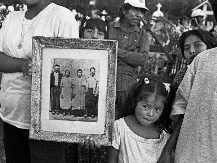 During the Day of the Dead festival, Stein would often visit the cemeteries where families honored their ancestors at their grave sites. Sometimes he would ask if he could take pictures of families holding images of their deceased family members.