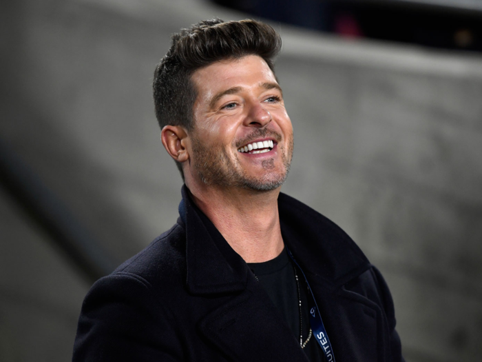 Singer Robin Thicke also enjoyed the game from in house Monday night.