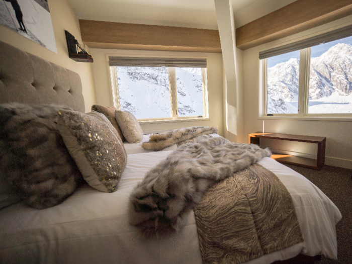 The chalet has five bedrooms, each with panoramic views of the surrounding snowy peaks.