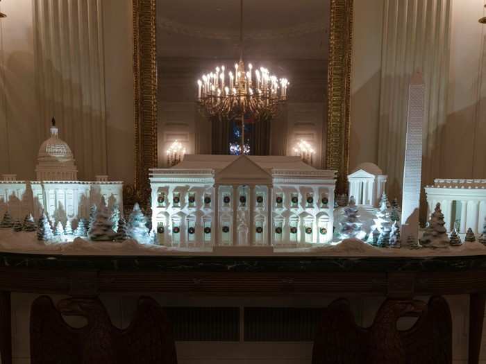 A gingerbread version of the National Mall is on display in the State Dining Room, which shows the Capitol, the Lincoln Memorial, the Jefferson Memorial, the Washington Monument, and the White House.