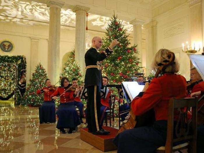 The US Marine Band played in the glistening Grand Foyer during the 2018 Christmas preview.