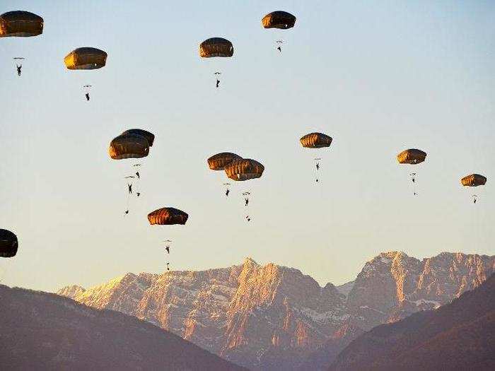 U.S. Army Paratroopers assigned to the 173rd Brigade Support Battalion, 173rd Airborne Brigade, descend onto Juliet Drop Zone in Pordenone, Italy during an airborne operation from a US Air Force 86th Air Wing C-130 Hercules aircraft Jan. 18, 2018.