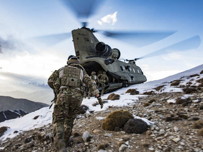 Air Force pararescuemen assigned to the 83rd Expeditionary Rescue Squadron work with members of Army Task Force Brawler, flying the CH-47F Chinook, during exfiltration after the completion of a training exercise at Bagram Airfield, Afghanistan on March 14, 2018.