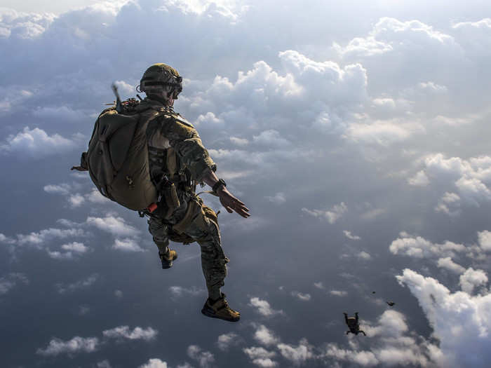 Airmen assigned to the 82nd Expeditionary Rescue Squadron and deployed in support of humanitarian aid and contingency operations in the Combined Joint Task Force-Horn of Africa area of responsibility perform a military free fall jump in Djibouti, April 17, 2018.