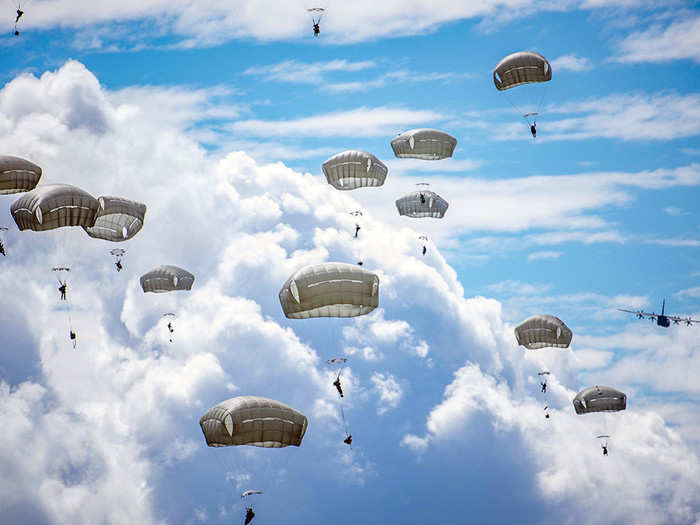  Paratroopers assigned to Army Alaska’s 4th Infantry Brigade Combat Team (Airborne), 25th Infantry Division descend toward Malemute Drop Zone at Joint Base Elmendorf-Richardson, Alaska, July 17, 2018. 