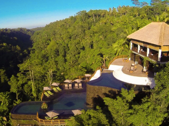 The way the pools are stacked gives them the illusion of floating above the jungle, both during the day ...