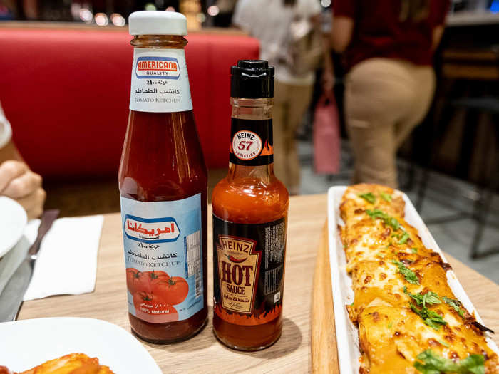 The condiments on the table were Heinz 57 hot sauce and some unfamiliar brand of ketchup. These were useful for the wedges.