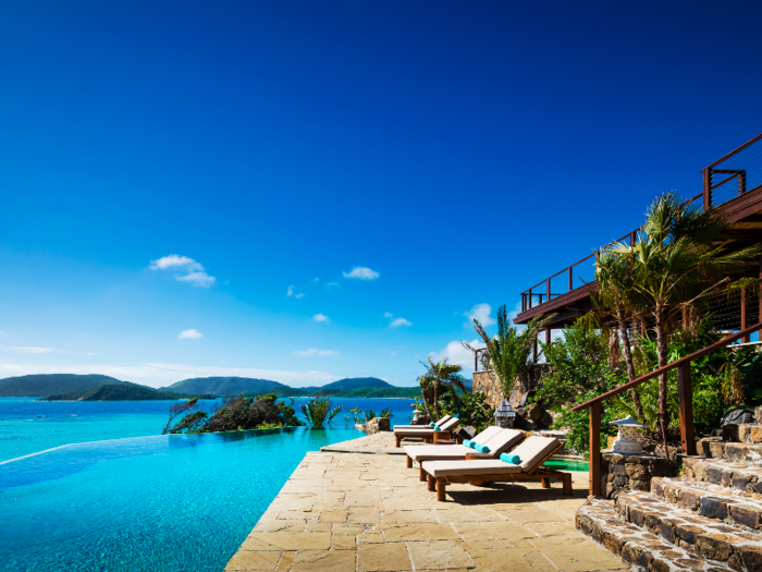 Guests can enjoy a swim in an infinity pool while gazing out at the sea and other Caribbean islands in the distance.