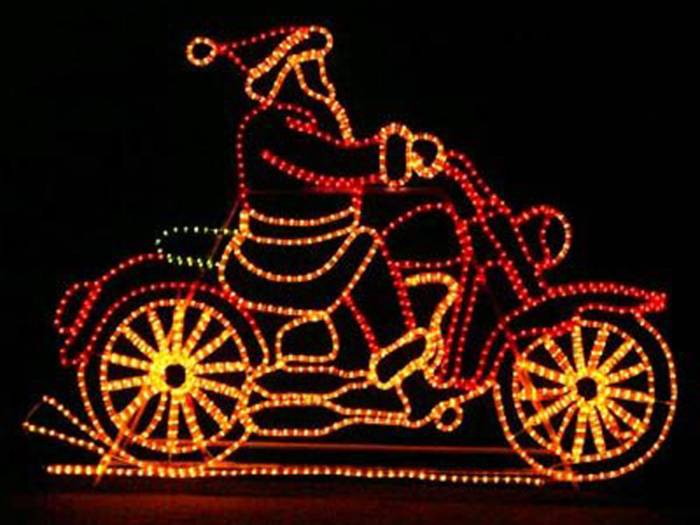 A light display of a genre-defying Santa Claus peeling out of your yard on a motorcycle