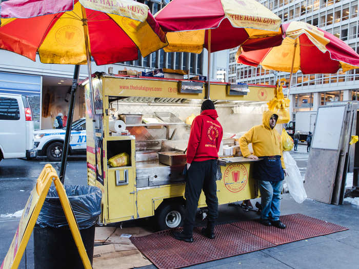 Even though the carts are small, there are quite a few people working at each. There are four servers who handle the food, one person who takes customer orders and handles money, and a few people who maintain the carts and clean up food that