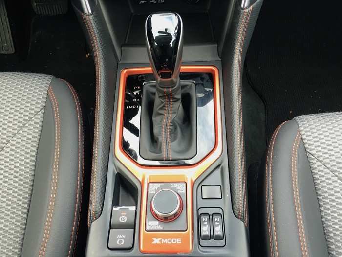 The center console also houses the shifter, the electronic parking brake, the heated seats, and the drive mode selector, more on that later.