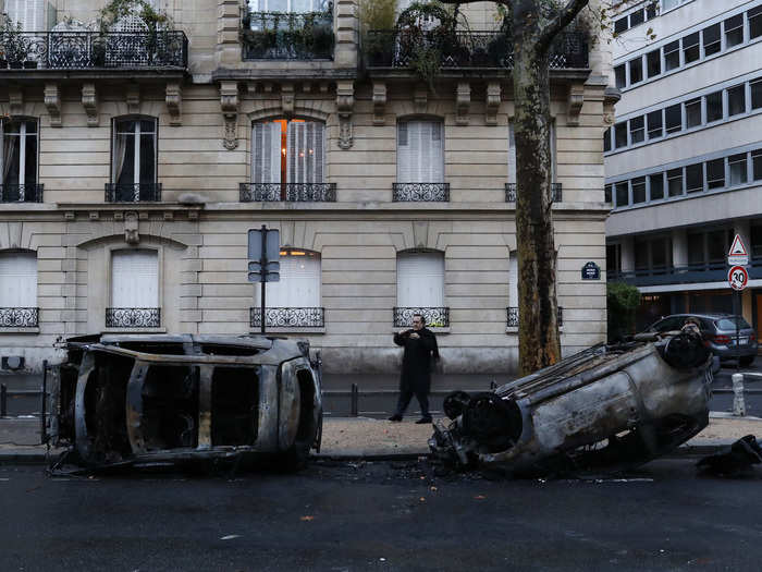 Those surveying the damage on Sunday found that the protests left burned cars and smashed stores in several of the wealthiest neighborhoods of Paris.