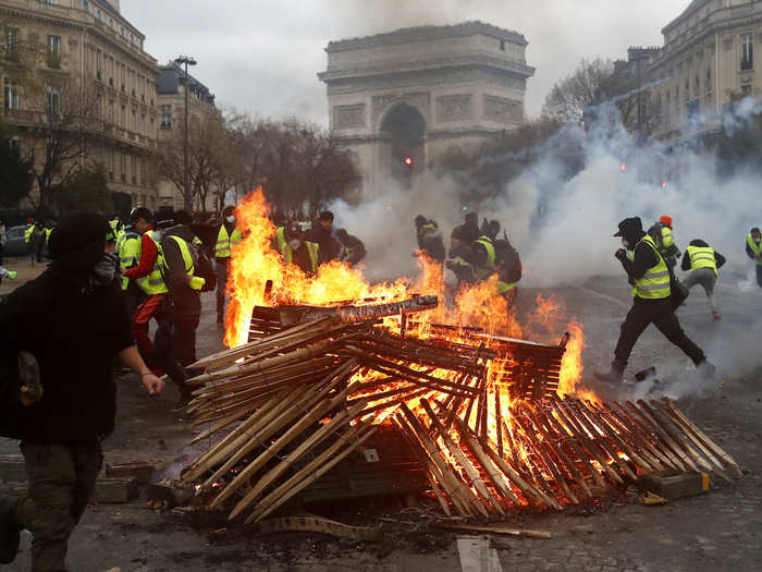 Protestors lit fires near the Arc de Triomphe.