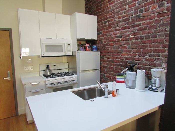 San Francisco has gotten so crowded, even its studio penthouses come without full kitchens.