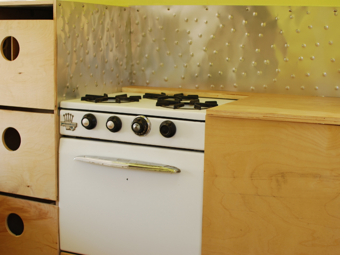 Though microapartments are not legal in the vast majority of the US, plenty of people rent them in San Francisco. The microkitchen below includes a small fridge hidden underneath the right-side cabinet.