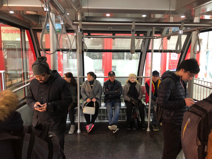 The interior of the trams resembles a wide subway car with fewer seats. Each car can fit up to 109 passengers, plus one attendant.