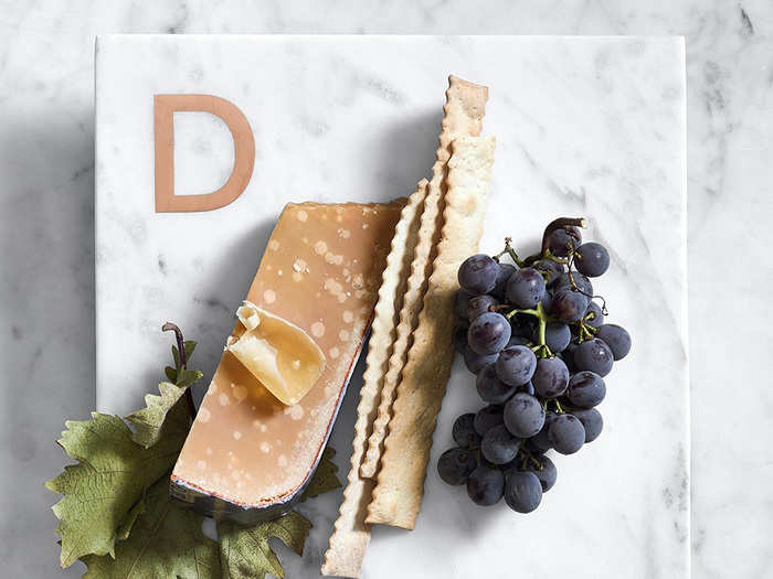 A nice marble cutting board with their initial at the top