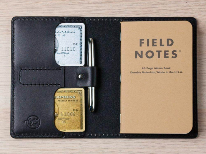 A full-grain leather notebook cover with a pen holder and card slots