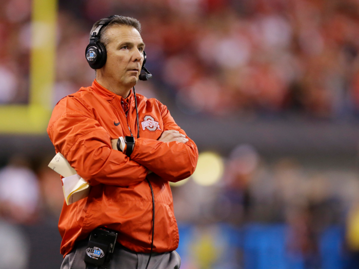 In his first season as head coach in Columbus, Meyer led Ohio State to a perfect 12-0 record, but the team was ineligible to compete in the postseason due to past NCAA violations.