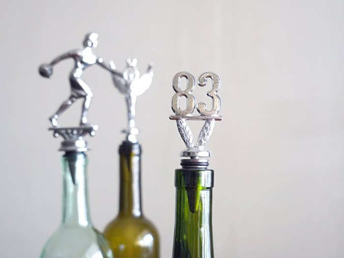 Wine bottle stoppers made from a vintage trophy