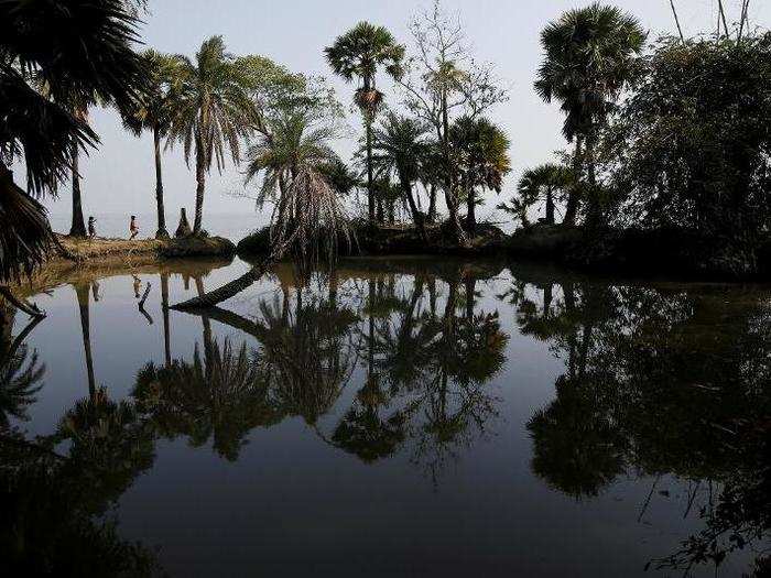 Ratan Maity told NPR that he moved to Sagar Island with his two children around 2001. "The river was angry," he said. "It took away so many things. It took people