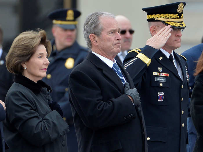 Former President George W. Bush and former First Lady Laura Bush stood outside the cathedral to salute the president