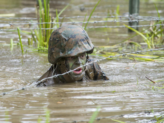 Or wading through water under barbed wire.