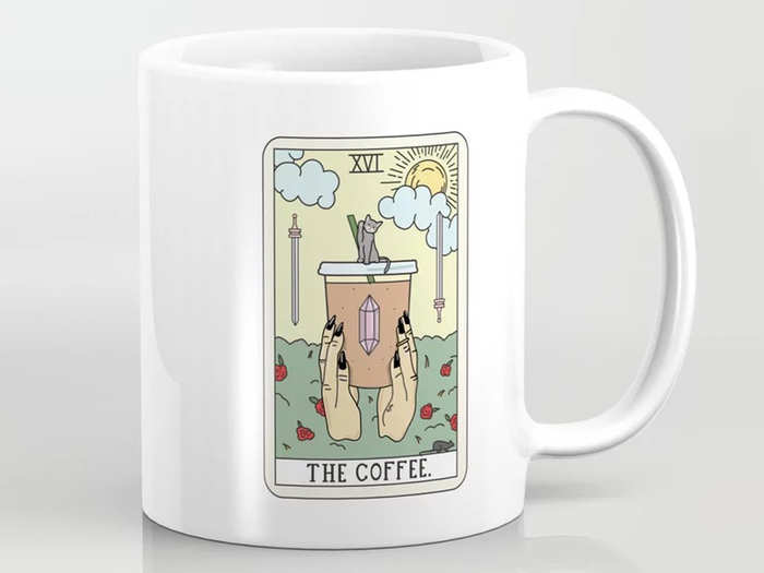 A mug with a "coffee reading" tarot-inspired theme
