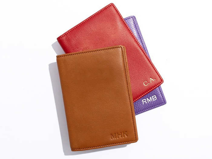 A monogrammed leather passport case