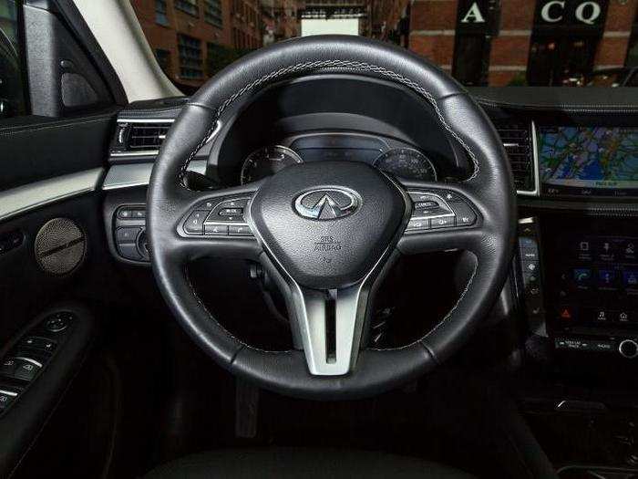 In front of the driver is a button-heavy, but well-designed leather-wrapped steering wheel.