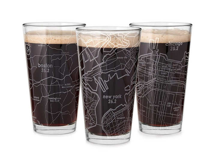 Pint glasses etched with famous marathon routes.