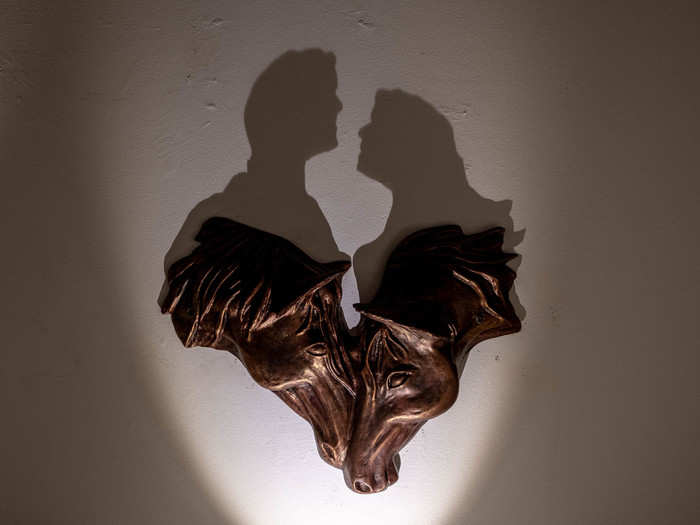 One of my favorite artists in Al Serkal was Jordanian couple Maysoon Masalha and Bassam Al Selawi, who create "shadow art" sculptures. The wooden sculptures depict one thing, while the shadow often depicts something entirely different. This sculpture of two horses kissing shows a man and a woman in the shadow.