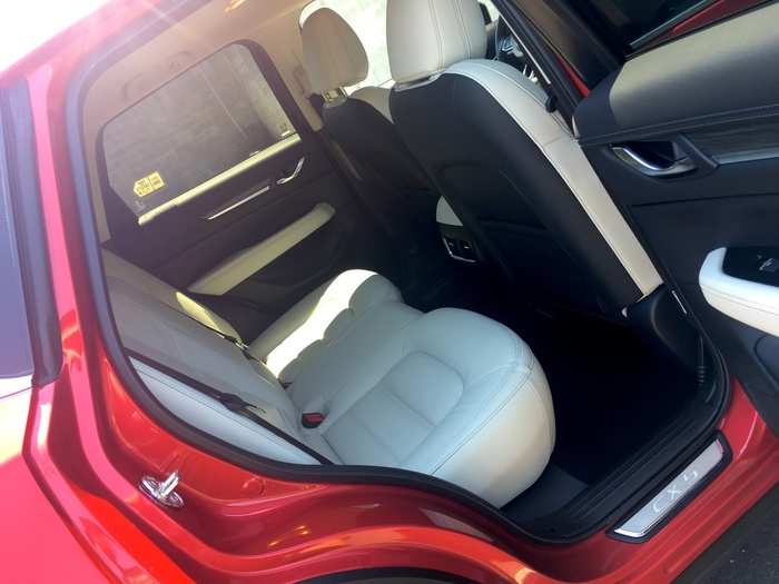 The rear cabin is roomy, with adequate space for two adults. The center seat is more geared toward children. The CX-5
