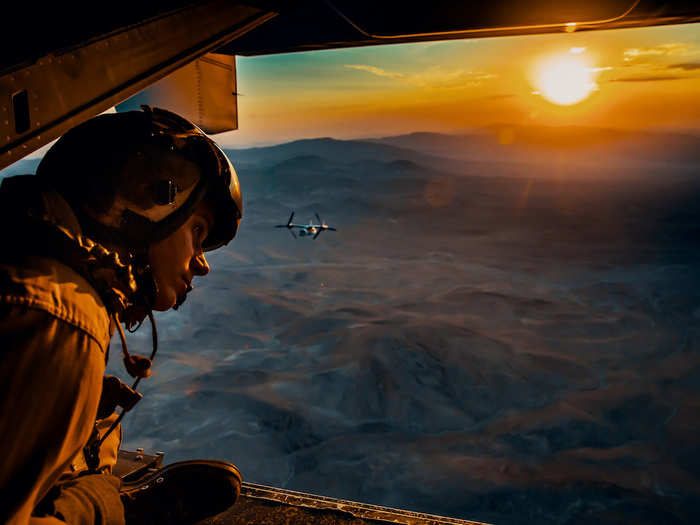 Marine Sgt. Derek Levi looks over the landscape of Marine Corps Air Ground Combat Center in Twentynine Palms, California, during an aerial flight formation exercise on August 12, 2018.