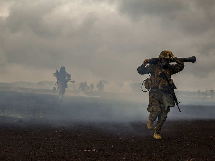 Marines maneuver from a chemically gassed area during Exercise Bougainville II at the Pohakuloa Training Area, Island of Hawaii on Oct. 20, 2018.