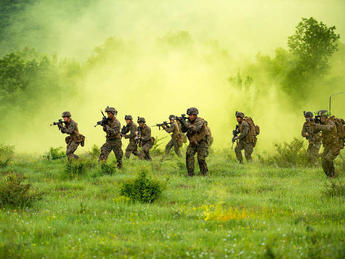 Marines advance to their objective during a patrolling exercise at US Army base Nova Selo Forward Operating Site in Bulgaria on May 10, 2018.