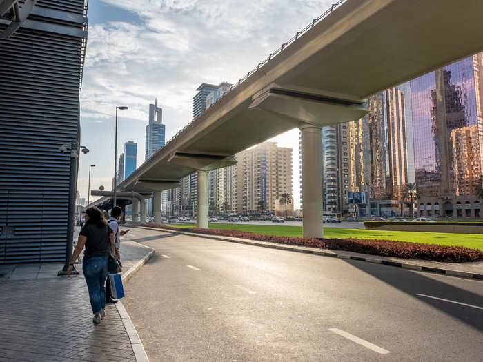 Despite the bustling highway and the numerous buildings that crowd the landscape, there are few, if any, people walking around.