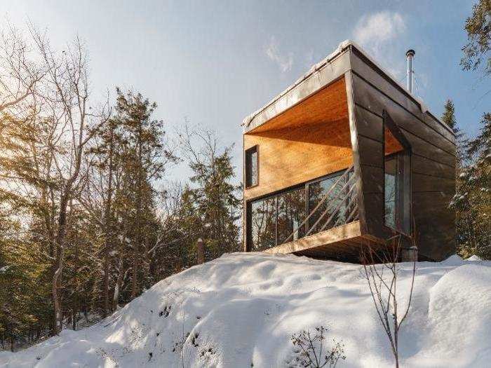 A small cabin on a rock overlooks a New Hampshire valley.