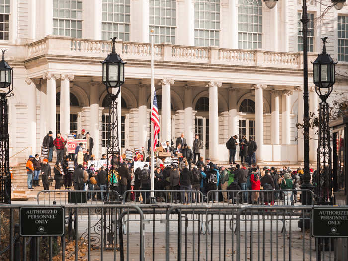 It was cold, but there were dozens of protesters outside. The crowd was chanting, "G-T-F-O Amazon has got to go."