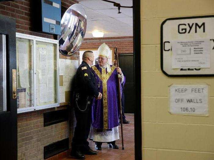 The prison has its fair share of visitors. Here, Cardinal Timothy Dolan greets a corrections officer during visit to the facility.