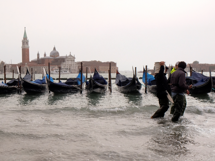 In this photo from October 2018, people are walking on a catwalk submerged in water.